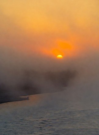 Serene morning lake with misty background
