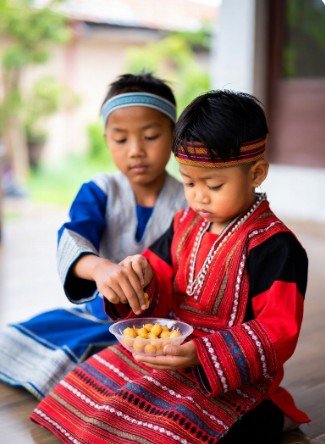 Children in Traditional Clothes Sharing Sweets2