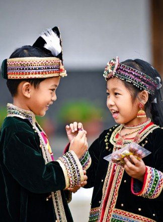 Children in Traditional Clothes Sharing Sweets3