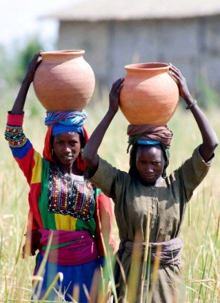 Women in Traditional Dress Carrying Pots3