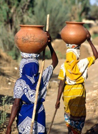 Women in Traditional Dress Carrying Pots5